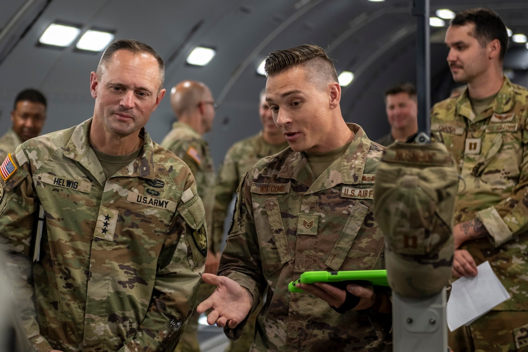 Army Lt. Gen. speaks with medical Airmen on a KC-46A Pegasus.