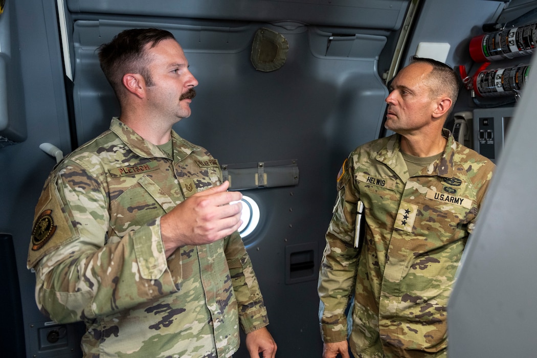 Army Lt. Gen. speaks with an Airman on a KC-46A Pegasus