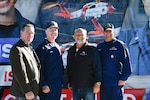 The Director of Community Development for the city of Bettendorf, Iowa, Mark Hunt, left, U.S. Coast Guard Vice Adm. Kevin Lunday, commander of Atlantic Area, middle left, the Mayor of Rock Island, Illinois, Mike Thoms, middle right, and Coast Guard Master Chief Petty Officer Jeremy DeMello, command master chief of Atlantic Area, right, pose for a group photo at the ‘Mission Mighty Mississippi’ event, Oct. 21, 2023, in Rock Island, Illinois. Lunday and crew members hosted the event to showcase Coast Guard capabilities and career opportunities in the region. (U.S. Coast Guard photo by Petty Officer 3rd Class Kate Kilroy)