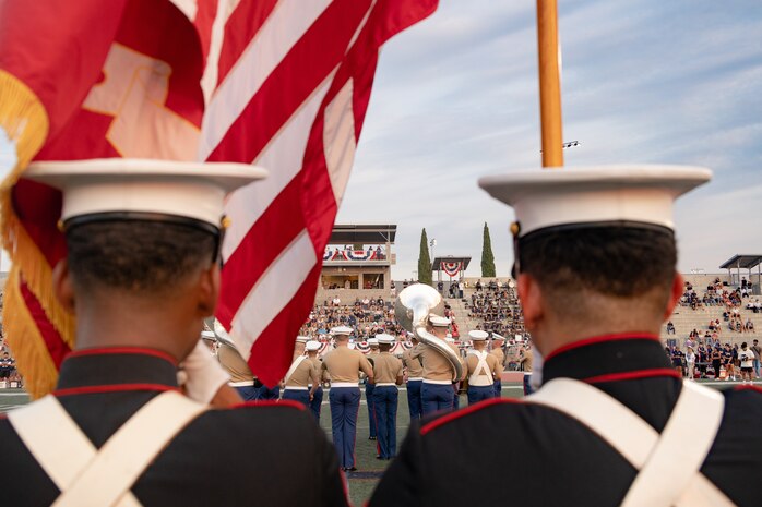 A U. S. Marine Corps color guard presents the colors at Del Norte High School, San Diego, California, Sept. 9, 2024. Service members from southern California, supported the Del Norte High School Military Appreciation football game with the presentation of the colors, a K-9 demonstration, a coin toss, and performance by Marine Band San Diego. (U.S. Marine Corps photo by Lance Cpl. Janell B. Alvarez)