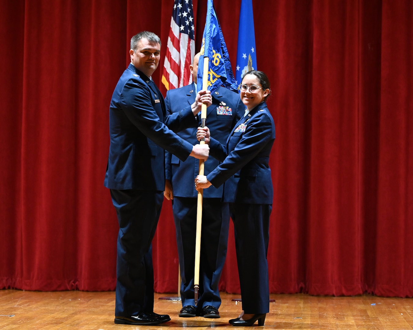 Lt. Col. Cassandra Lee assumes command of the 426th Cyberspace Operations Squadron and is passed the colors by Col. Richard Wallace, 960th Cyberspace Operations Group commander, at Joint Base San Antonio-Lackland, Texas on September 15th, 2024. (US Air Force photo by Alex Dieguez)
