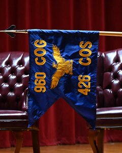 The squadron guidon for the 426th Cyberspace Operations Squadron is revealed during the redesignation ceremony at Joint Base San Antonio-Lackland, Texas on September 15th, 2024. (US Air Force photo by Alex Dieguez)
