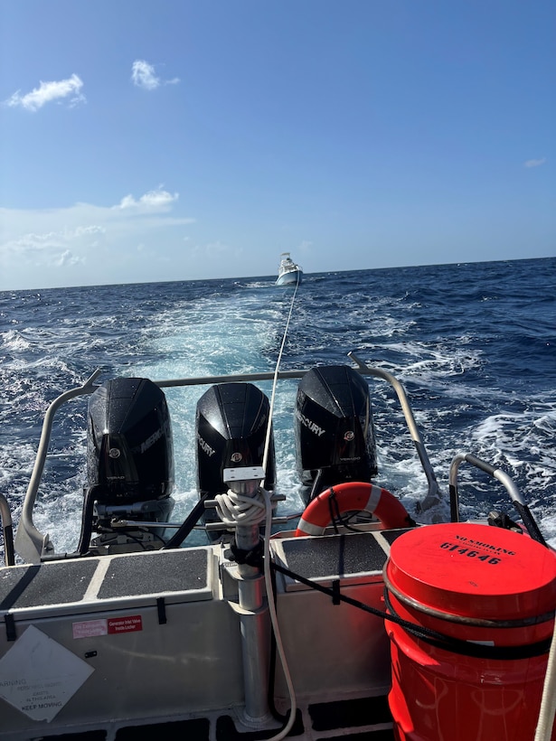 A Coast Guard 33-foot Special purpose craft boat crew conducts a three-hour tow of the Kraken Up, a 35-foot cuddy cabin vessel, with two people onboard, after the vessel sustained an electrical fire and became disabled, approximately 11 nautical miles, north of St. Croix, U.S. Virgin Islands, Sept. 15, 2024. The vessel was brought to safe a haven at Green Cay Marina in St. Croix.  No injuries were reported in this case. (Courtesy photo)