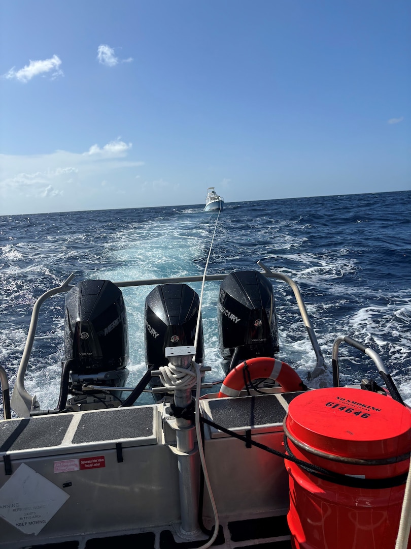 A Coast Guard 33-foot Special purpose craft boat crew conducts a three-hour tow of the Kraken Up, a 35-foot cuddy cabin vessel, with two people onboard, after the vessel sustained an electrical fire and became disabled, approximately 11 nautical miles, north of St. Croix, U.S. Virgin Islands, Sept. 15, 2024. The vessel was brought to safe a haven at Green Cay Marina in St. Croix.  No injuries were reported in this case. (Courtesy photo)