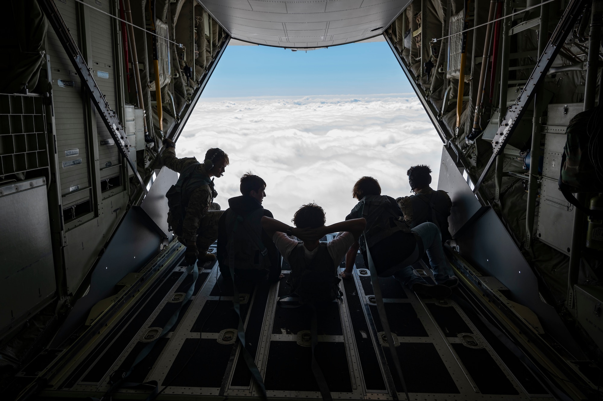 High school students from the greater Jackson, Mississippi area sit on the ramp of an MC-130J Commando II during an inspiration flight with the 15th Special Operations Squadron near Jackson, Mississippi, Sept. 13, 2024.