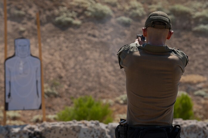U.S. Marine Corps Lance Cpl. Hunter A. Dalecke-Sabandith, special reaction team entryman, with the Provost Marshal's Office, Headquarters and Service Battalion, Marine Corps Recruit Depot San Diego, fires a M18 military service pistol at Marine Corps Air Station Miramar, California, Sept. 9, 2024. The members of SRT are military police officers with advanced training responsible for responding to emergencies such as active shooter and hostage situations. During the range SRT completed their monthly qualification with the M18 service pistol. (U.S. Marine Corps photo by Lance Cpl. Janell B. Alvarez)