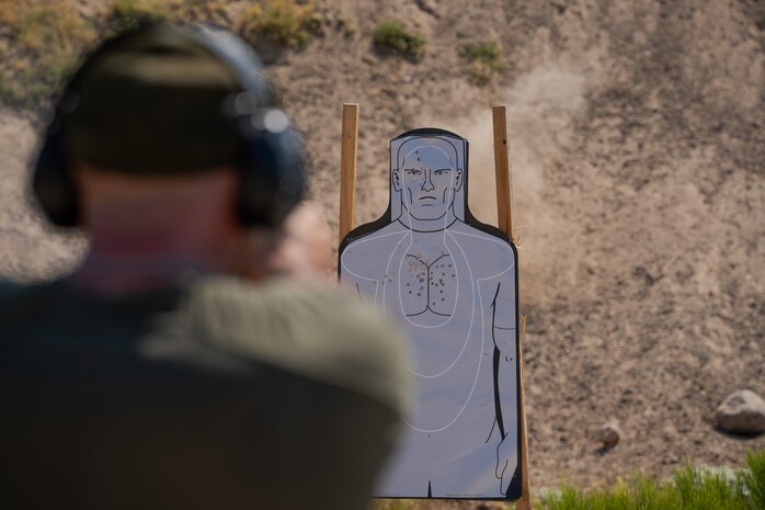 U.S. Marine Corps Staff Sgt. Ethan A. Coro, special reaction team commander with the Provost Marshal's Office, Headquarters and Service Battalion, Marine Corps Recruit Depot San Diego, fires a M18 military service pistol at Marine Corps Air Station Miramar, California, Sept. 9, 2024. The members of SRT are military police officers with advanced training responsible for responding to emergencies such as active shooter and hostage situations. During the range SRT completed their monthly qualification with the M18 service pistol. (U.S. Marine Corps photo by Lance Cpl. Janell B. Alvarez)