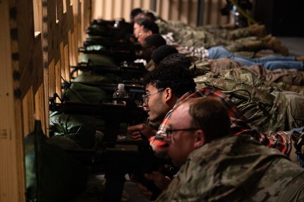 U.S. Airmen from Joint Base Andrews, Md., use an Engagement Skills Trainer during a bivouac training exercise at Fort Indiantown Gap, Pa., Sept. 4, 2024. The trainer is a computer-based weapon simulator designed to teach Airmen combat and readiness skills. (U.S. Air Force photo by Staff Sgt. Alex Broome)