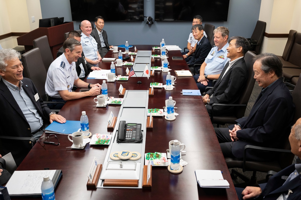 Photo of U.S. Air Force general speaking with Japanese leaders