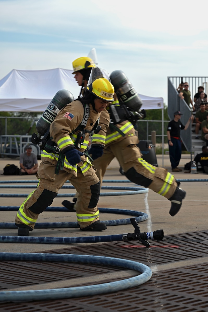 Students assigned to the 312th Training Squadron compete in the 12th Annual Blood, Sweat & Stairs event at the Louis F. Garland Department of Defense Fire Academy, Goodfellow Air Force Base, Texas, Sept. 13, 2024. The combat challenge tests strength, speed and endurance, but above all, it tests the participants' ability to work as a team. (U.S. Air Force photo by Airman 1st Class Madi Collier)