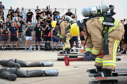 Students assigned to the 312th Training Squadron swing a sledgehammer in the ‘Keiser sled’ event while participating in the combat challenge during the 12th Annual Blood, Sweat & Stairs event at the Louis F. Garland Department of Defense Fire Academy, Goodfellow Air Force Base, Texas, Sept. 13, 2024. The Keiser sled represented first responders using tools to break down doors and through rubble during 9/11. (U.S. Air Force photo by Airman 1st Class Madi Collier)