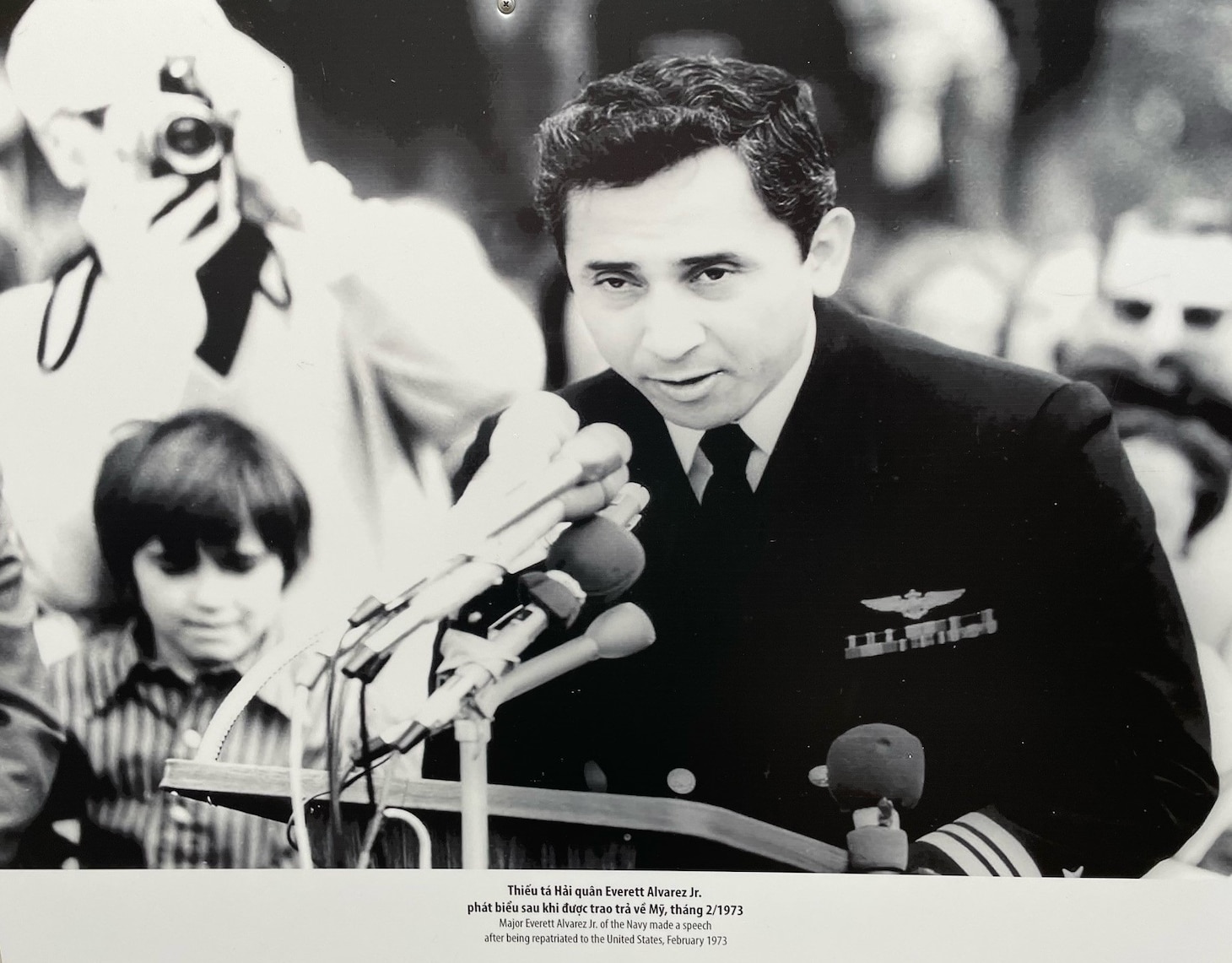 Lt. Cmdr. Everett Alvarez, Jr. speaks to the crowd during a welcome-home ceremony in February 1973 (photo on display at Hoa Lo Prison Relic in Hanoi, Vietnam). Alvarez was a prisoner of war (POW) for the entire duration of the Vietnam War—making him the longest-held POW in North Vietnam. He was released on Feb. 12, 1973 (courtesy of Shawn Vreeland).