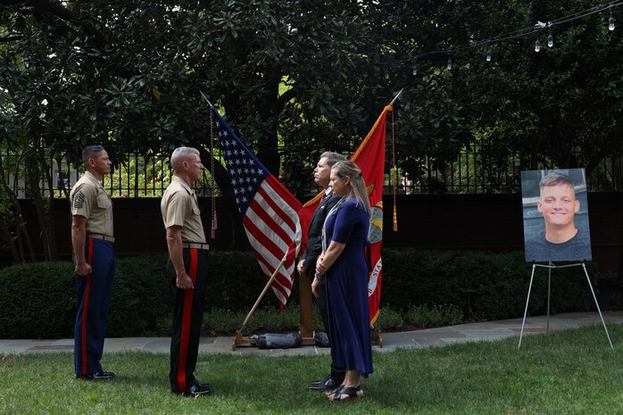 The family of Cpl. Spencer Collart attend a ceremony pose for a photo during an award presentation post humously honoring his heroic actions, Sept. 16, 2024, at Marine Barracks Washington. Gen. Eric M. Smith, 39th Commandant of the Marine Corps, posthumously awarded the Navy and Marine Corps Medal to Cpl. Collart's family in recognition of the heroic actions Collart made while attempting to save the lives of his fellow Marines following a crash of their MV-22 Osprey on Aug. 27, 2023. (U.S. Marine Corps photo by Sgt. Tawanya Norwood)
