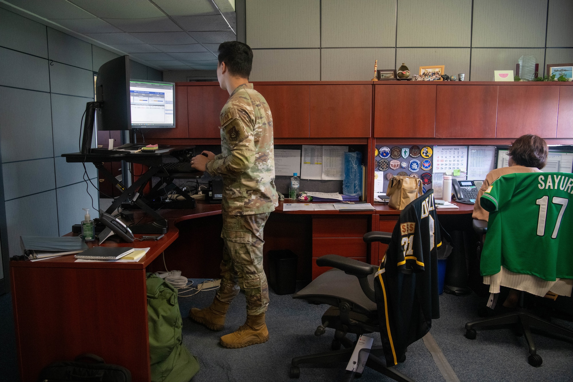 Staff Sgt. Andrew Deleon works at a desktop at 18th CPTS