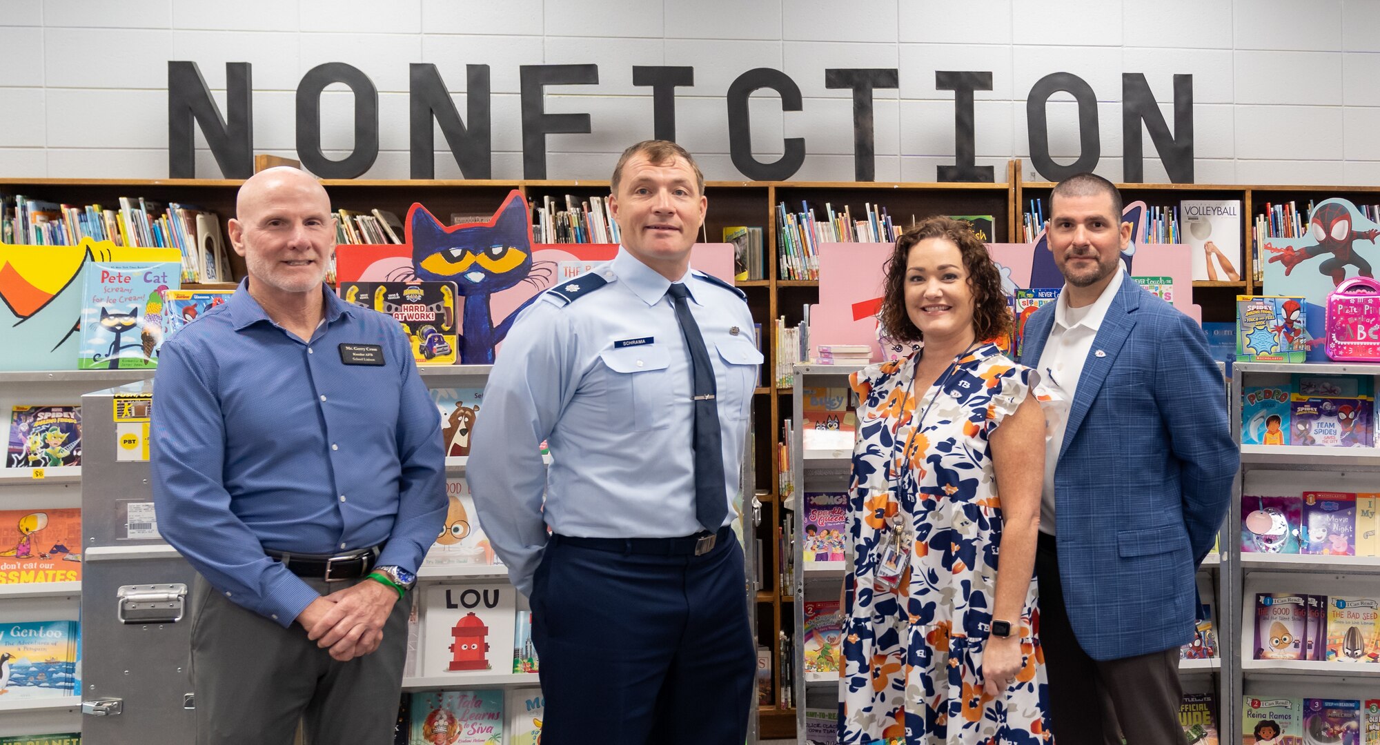 U.S. Air Force Lt. Col. Michael Schrama, 81st Training Wing military school advisor, Gerald Cross, Keesler school liaison, Brooke Fontenelle, Back Bay Elementary School principal, and Mr. Marcus Boudreaux, Biloxi Public School superintendent, pose for a photo during a tour of the Back Bay Elementary School, Biloxi, Mississippi, Sept. 9, 2024.
