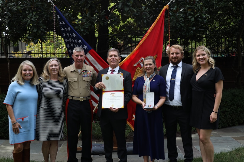 The family of Cpl. Spencer Collart attend a ceremony pose for a photo during an award presentation post humously honoring his heroic actions, Sept. 16, 2024, at Marine Barracks Washington. Gen. Eric M. Smith, 39th Commandant of the Marine Corps, posthumously awarded the Navy and Marine Corps Medal to Cpl. Collart's family in recognition of the heroic actions Collart made while attempting to save the lives of his fellow Marines following a crash of their MV-22 Osprey on Aug. 27, 2023. (U.S. Marine Corps photo by Sgt. Tawanya Norwood)