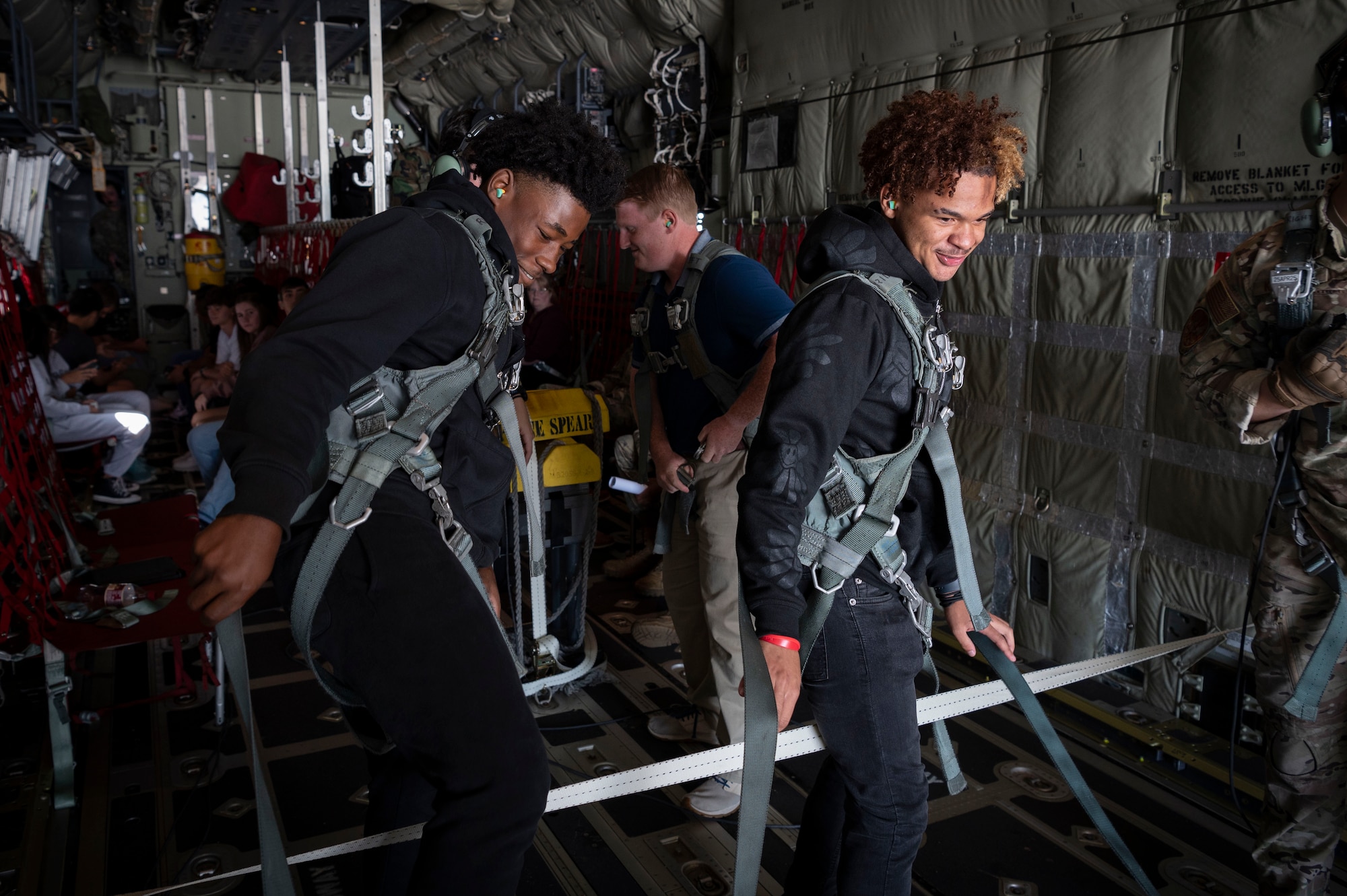 High school students from the greater Jackson, Mississippi area prepare to sit on the ramp of an MC-130J Commando II during an inspiration flight with the 15th Special Operations Squadron near Jackson, Mississippi, Sept. 13, 2024.