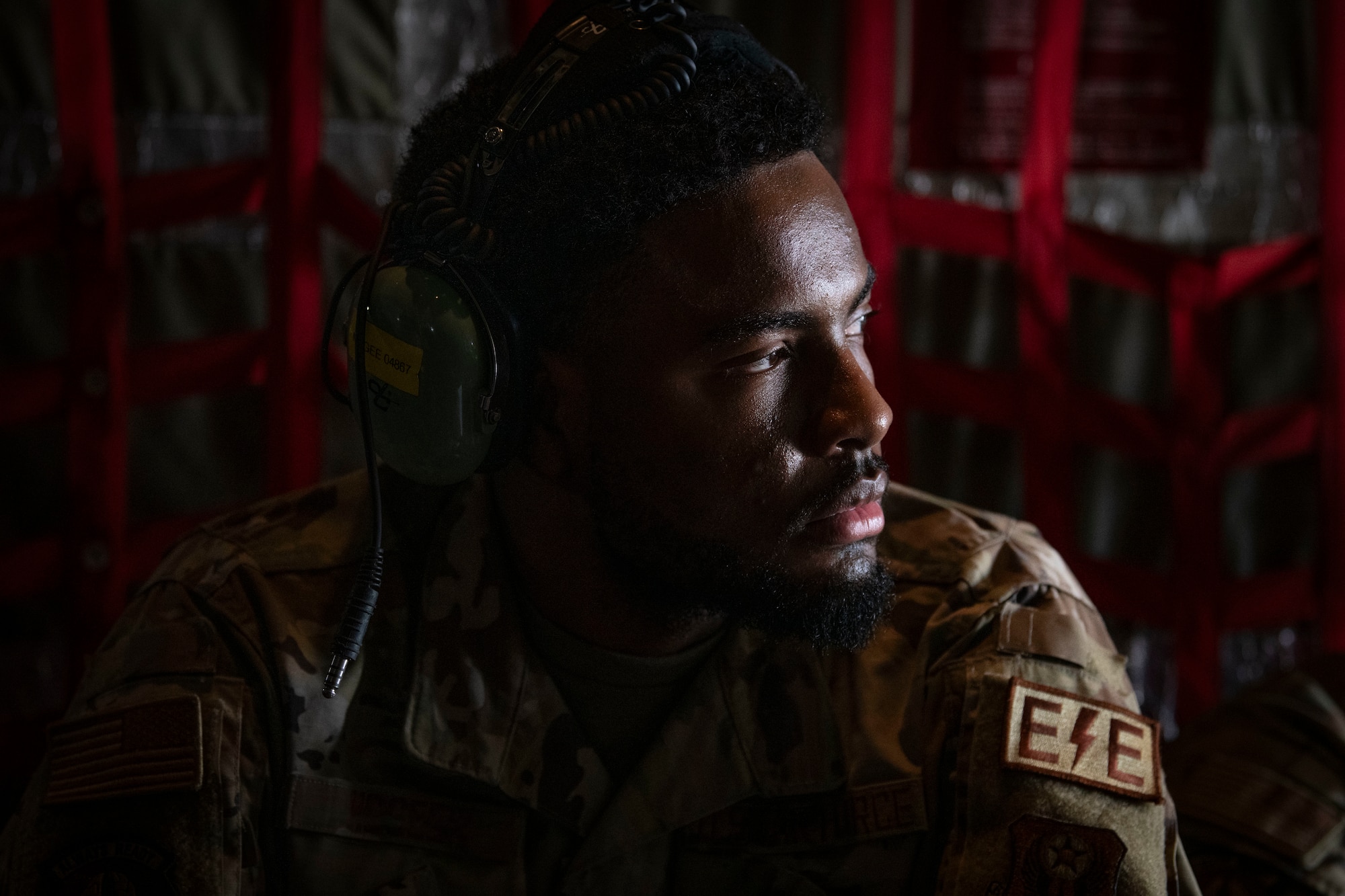 An electrical and environmental systems specialist assigned to the 15th Special Operations Aircraft Maintenance Squadron looks out the back of an MC-130J Commando II during an inspiration flight near Jackson, Mississippi, Sept. 13, 2024.