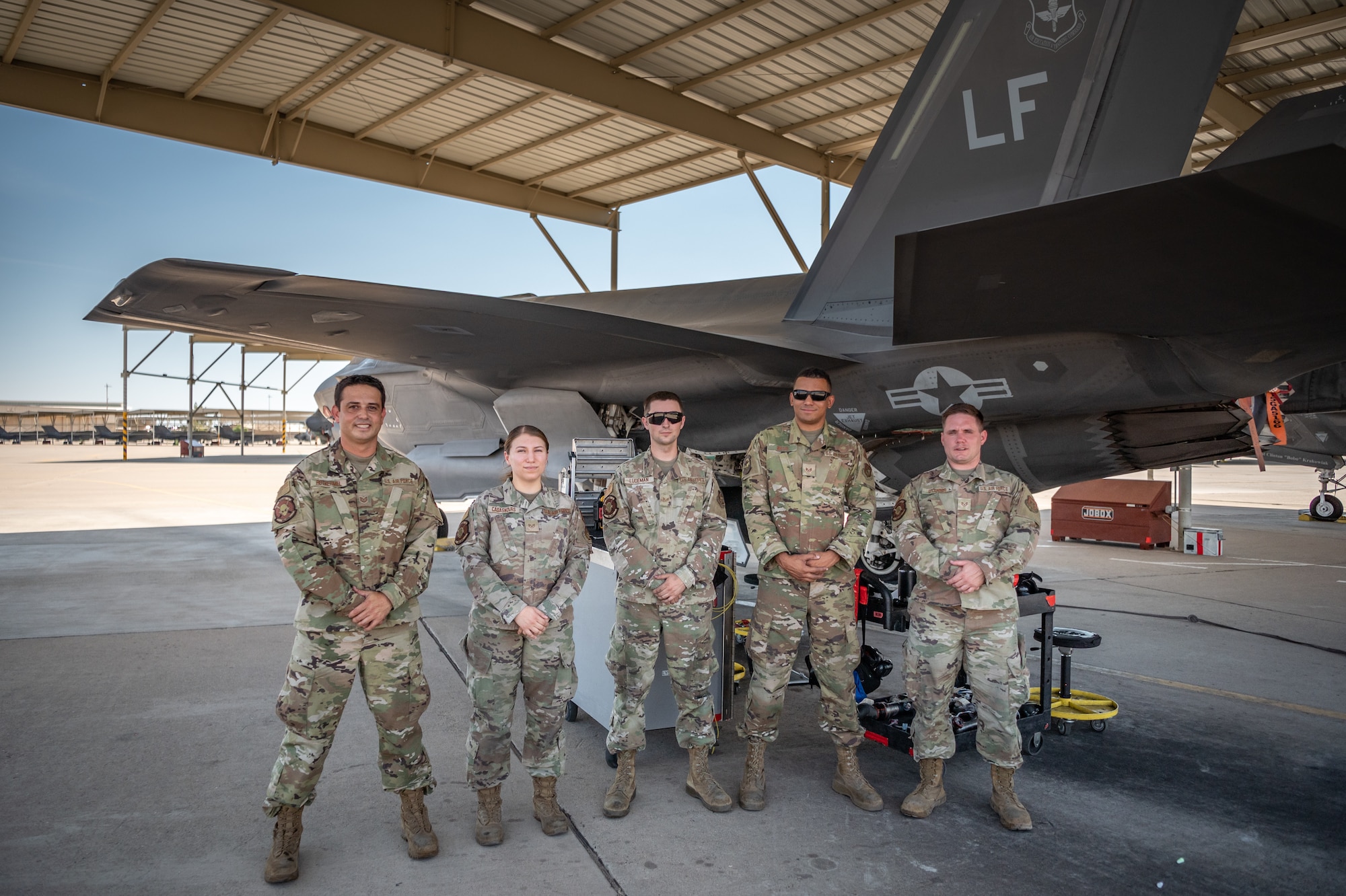 Reserve Citizen Airmen maintainers from the 944th Maintenance Group pose for a group photo in front of an F-35 at Luke Air Force Base, Ariz., Sept. 8, 2024. The maintainers work through extreme Arizona heat to ensure the Air Force's jets are mission-ready. (U.S. Air Force photo by Tech. Sgt. Tyler J. Bolken)