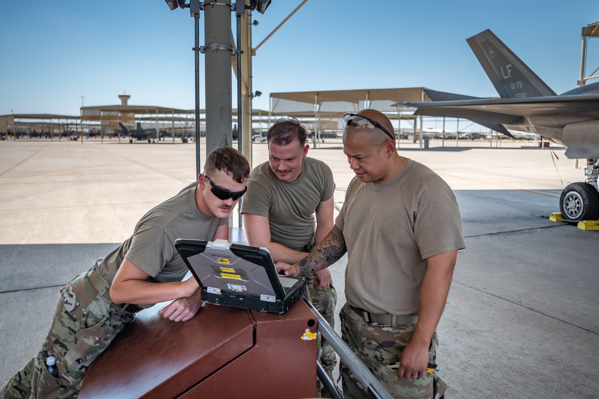 Reserve Citizen Airmen from the 944th Maintenance Group collaborate while conducting F-35 maintenance at Luke Air Force Base, Ariz., Sept. 8, 2024. Their teamwork ensures mission readiness for the fighter jets. (U.S. Air Force photo by Tech. Sgt. Tyler J. Bolken)