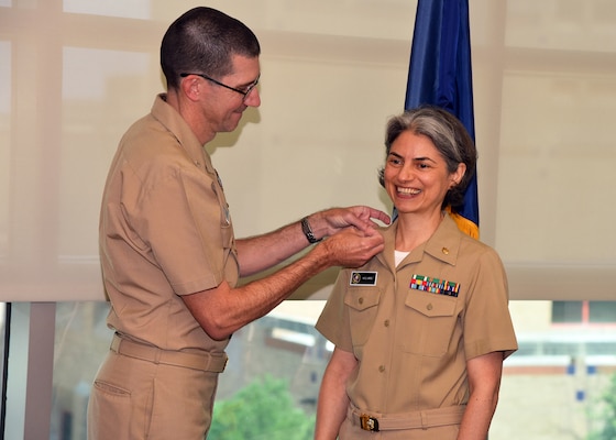 JOINT BASE SAN ANTONIO-FORT SAM HOUSTON – (Sept. 13, 2024) – Lt. Anca Selariu, a microbiologist assigned to Naval Medical Research Unit (NAMRU) San Antonio, was promoted to the rank of lieutenant commander during a promotion ceremony held at the Battlefield Health and Trauma Research Institute. Selariu, a Medical Service Corps officer who has been in America’s Navy for five years, recently served as the science officer on a 4-person team that took part in the NASA Crew Health and Performance Exploration Analog’s (CHAPEA) first mission from June 25, 2023, to July 6, 2024. The CHAPEA missions, simulated expeditions to the surface of Mars, aim to collect critical data which will inform future human expeditions to space. Pinning on her insignia was NAMRU San Antonio Executive Officer Cmdr. Nicholas Hamlin. NAMRU San Antonio is one of the leading research and development laboratories for the U.S. Navy under the Department of Defense (DoD) and is one of eight subordinate research commands in the global network of laboratories operating under the Naval Medical Research Command in Silver Spring, Md.  Its mission is to conduct gap driven combat casualty care, craniofacial, and directed energy research to improve survival, operational readiness, and safety of DoD personnel engaged in routine and expeditionary operations. (U.S. Navy photo by Burrell D. Parmer, NAMRU San Antonio Public Affairs/Released)