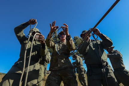 U.S. Army Staff Sgt. Alec Canepa, a combat engineer with the Nevada Army National Guard’s 609th Engineer Company, instructs Republic of Fiji Military Forces soldiers in military mountaineering techniques during Exercise Cartwheel 2024 in Fiji’s Nausori Highlands Sept. 11, 2024. The Nevada Guard members took the lead in rappel and squad live fire portions of the exercise, which is designed to enhance expeditionary partner force readiness and increase capabilities to respond to crises and contingencies throughout the Indo-Pacific.