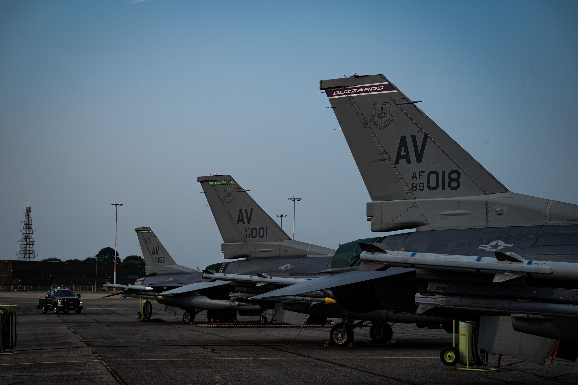 U.S. Air Force F-16 Fighting Falcons from the 555th and 510th Fighter Squadrons, Aviano Air Base, Italy, are parked in a row after arriving for Cobra Warrior 24-2 at Royal Air Force Mildenhall, England, Sept. 6, 2024.