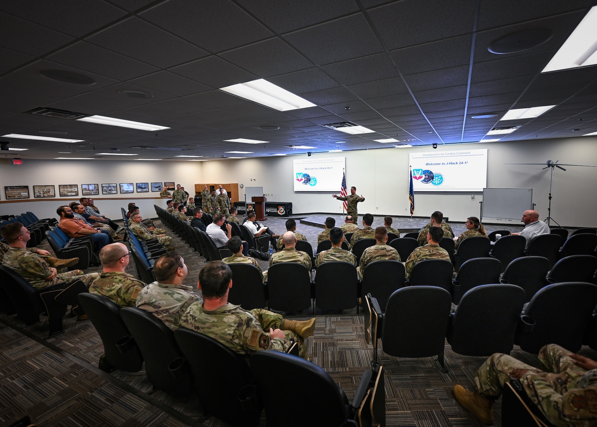 U.S. Air Force Col. Thomas Place, Air Combat Command Data and Artificial Intelligence Office, Chief AI Officer, gives opening remarks for a hackathon