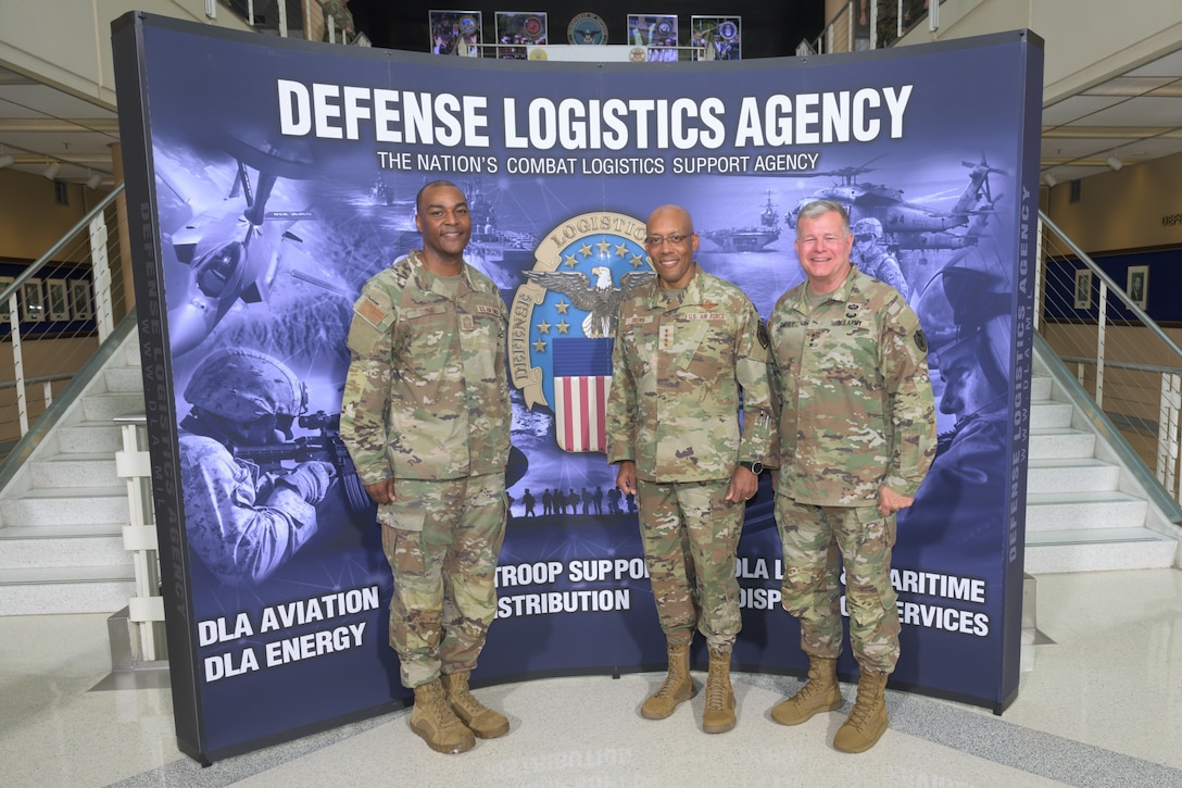 Defense Logistics Agency Director Army Lt. Gen. Army Lt. Gen. Mark Simerly, left, Chairman of the Joint Chiefs of Staff Air Force Gen. Charles Q. Brown Jr., center, and DLA Senior Enlisted Leader Air Force Command Chief Master Sergeant Alvin R. Dyer pose for a photo during the Worldwide Logistics Symposium at the McNamara Headquarters Complex at Fort Belvoir, Virginia