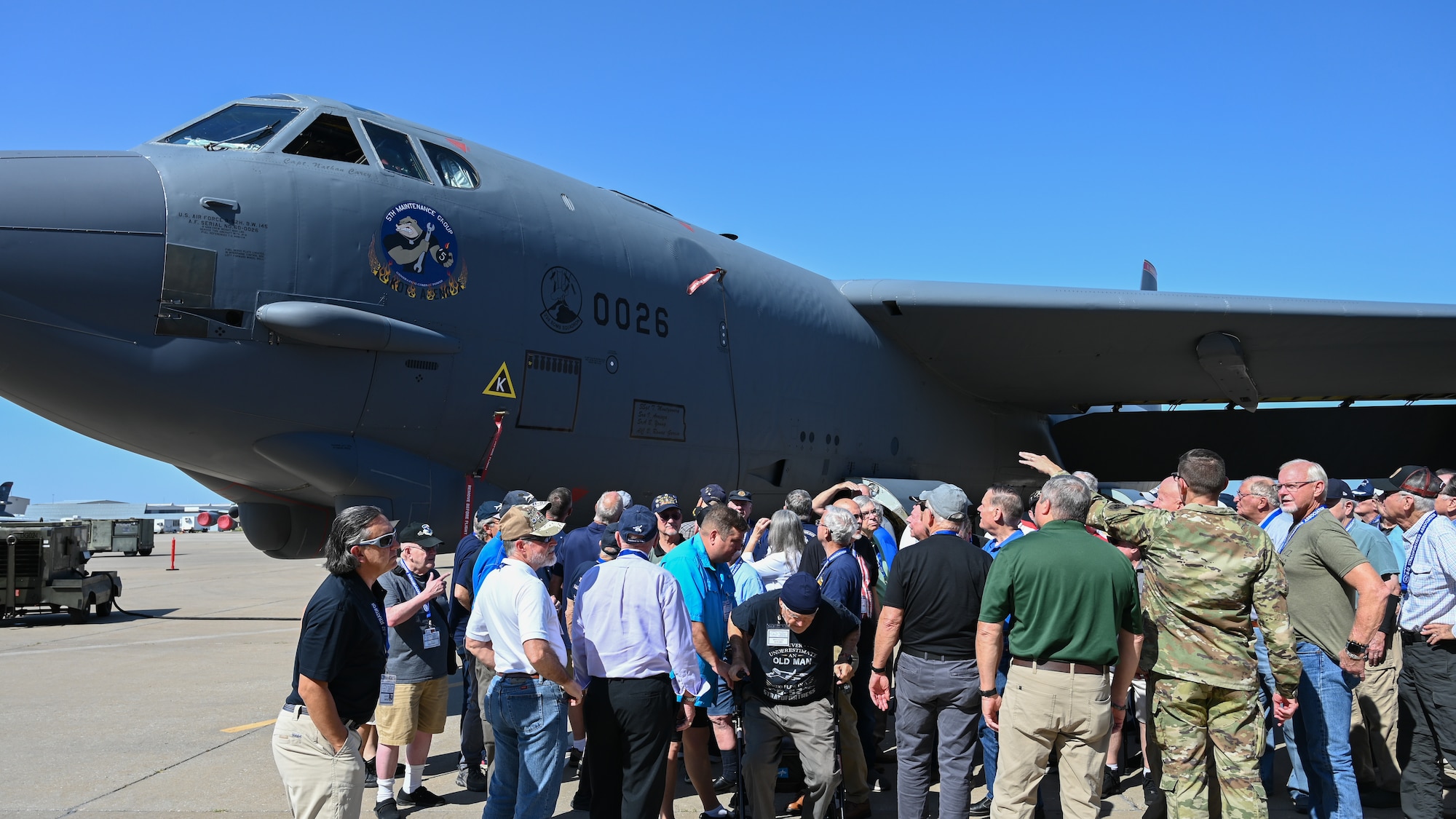 Group of people looking at aircraft.