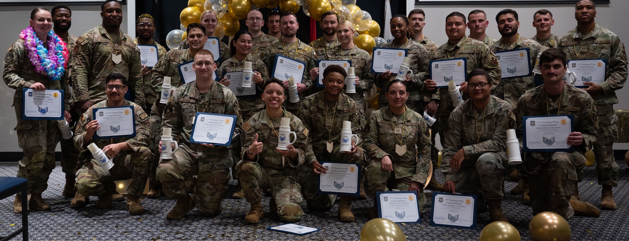 U.S. Air Force staff sergeant selects assigned to Goodfellow pose for a group photo during the Staff Sergeant Release Party at the Powell Event Center, Goodfellow Air Force Base, Texas, Sept. 13, 2024. It is common for selects to celebrate together as they progress their Air Force careers further into the next rank. (U.S. Air Force photo by Airman 1st Class Brian Lummus)