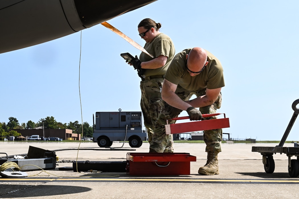 Tech. Sgt. Keri Savick, assistant Dedicated Crew Chief with the 910th Aircraft Maintenance Squadron, and Tech. Sgt. Jason Ross, DCC with the 910th AMXS, perform maintenance work on a C-130H Hercules at Youngstown Air Reserve Station, Ohio, Sept. 12, 2024.