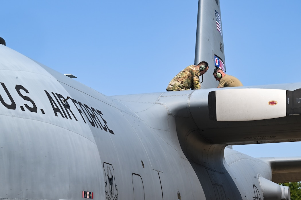 Tech. Sgt. Luke Prox, assistant Dedicated Crew Chief with the 910th Aircraft Maintenance Squadron, and Master Sgt. Levi Boyd, DCC with the 910th AMXS, perform maintenance work on the wing of a C-130H Hercules at Youngstown Air Reserve Station, Ohio, Sept. 12, 2024.