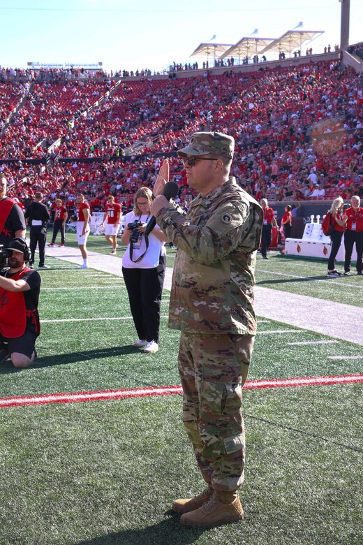 1st TSC Soldiers reenlist during half time while Cardinals mark