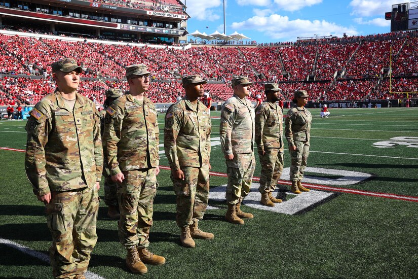 1st TSC Soldiers reenlist during half time while Cardinals mark