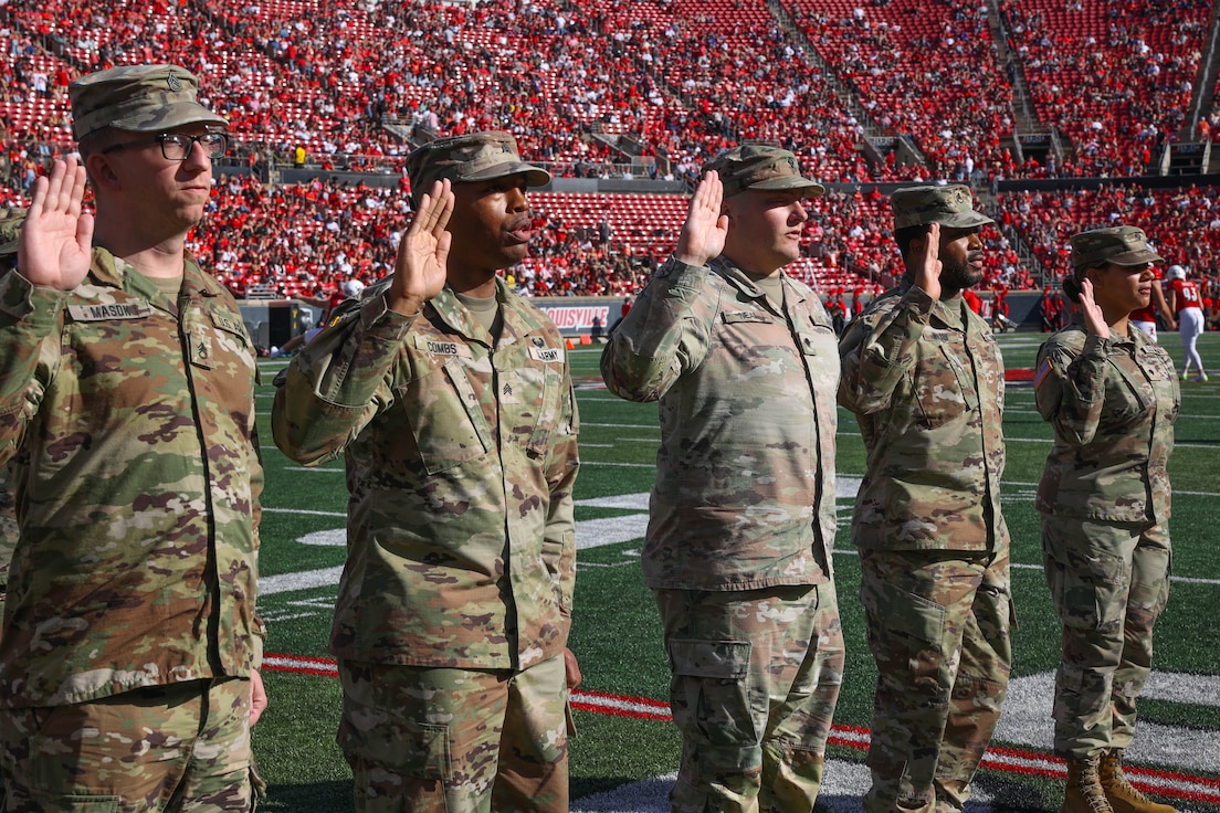 1st TSC Soldiers reenlist during half time while Cardinals mark another win