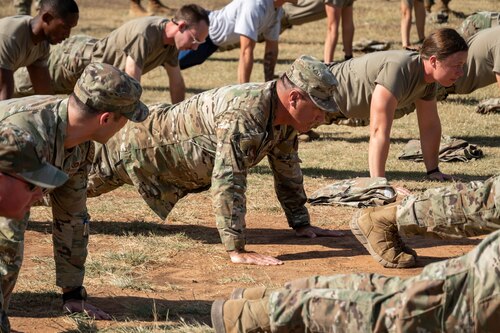 Airmen do pushups outside
