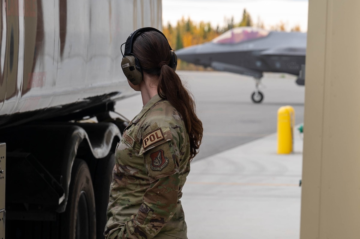 U.S. Air Force Airman Kaelin Sanders, 354th Logistics Readiness Squadron fuels operator, watches as an F-35A Lightning II taxis onto the flightline at Eielson Air Force Base, Alaska, Sept. 12, 2024.