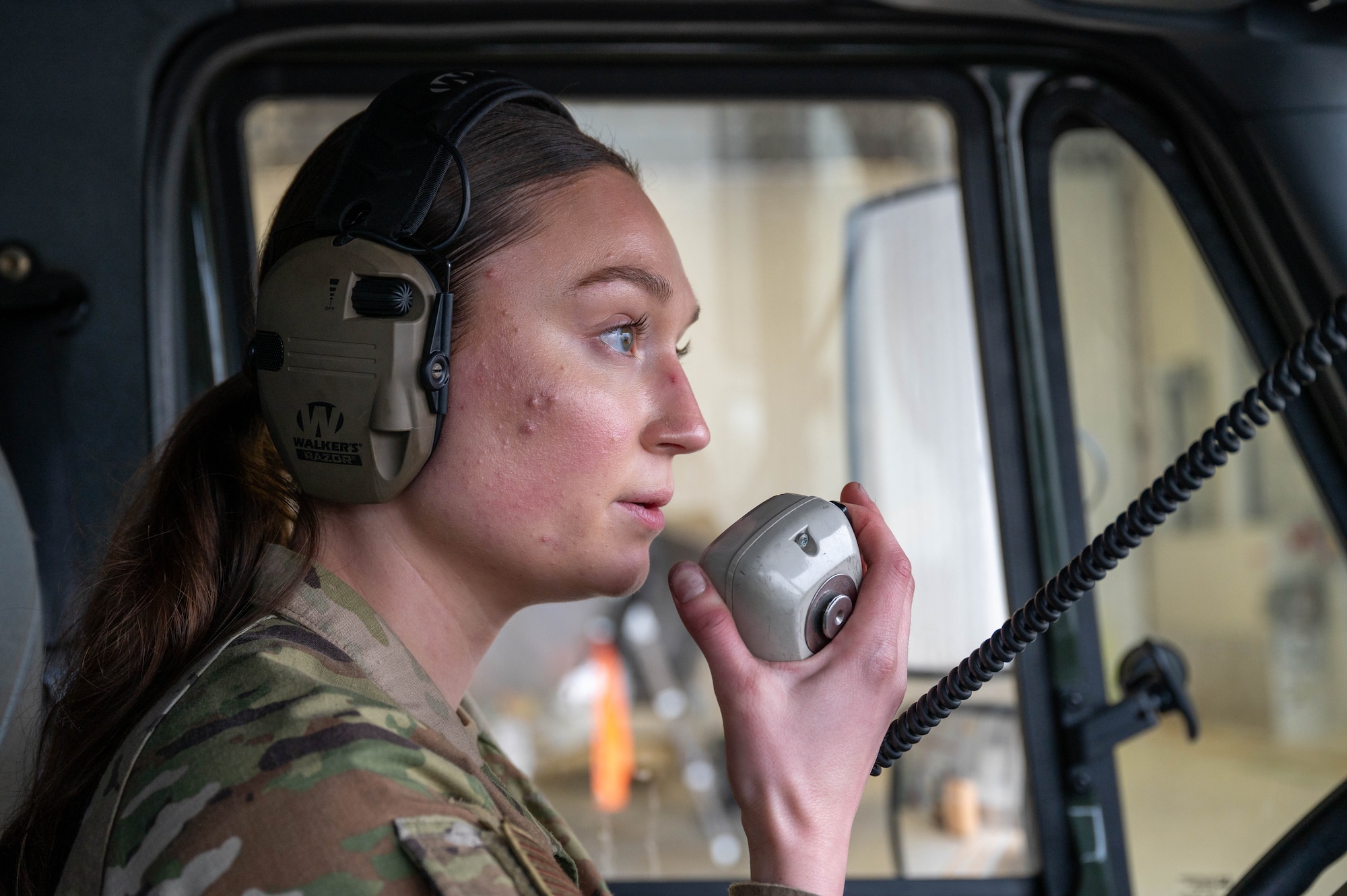 U.S. Air Force Airman Kaelin Sanders, 354th Logistics Readiness Squadron fuels operator, speaks on a radio inside an R11 aircraft refueling vehicle at Eielson Air Force Base, Alaska, Sept. 12, 2024.