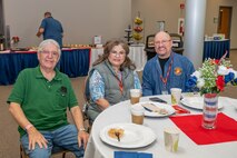 Photo of attendees sitting at a table