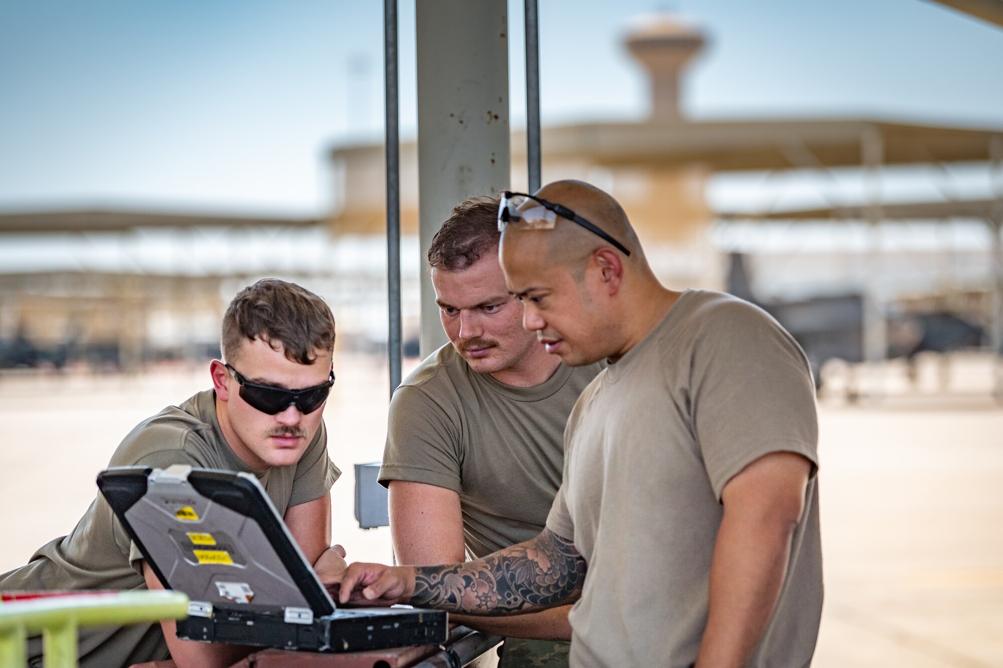 A team of 944th Maintenance Group Reserve Citizen Airmen review technical details of an F-35 on a laptop while working on the flight line at Luke Air Force Base, Ariz., Sept. 8, 2024. Their collaboration is essential to maintaining mission-capable aircraft. (U.S. Air Force photo by Tech. Sgt. Tyler J. Bolken)