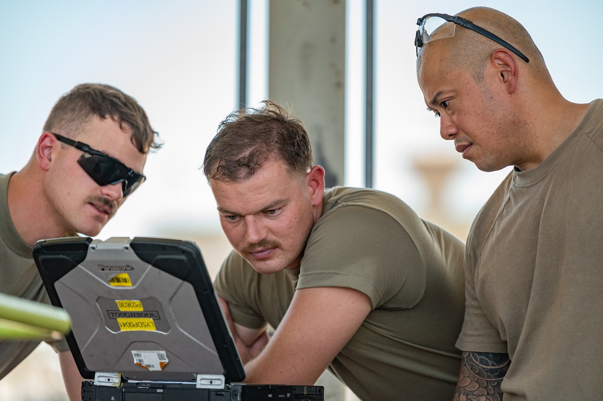 Reserve Citizen Airmen from the 944th Maintenance Group review data on a laptop while working on an F-35 at Luke Air Force Base, Ariz., Sept. 8, 2024. The use of digital tools enhances the maintainers' ability to troubleshoot issues quickly. (U.S. Air Force photo by Tech. Sgt. Tyler J. Bolken)