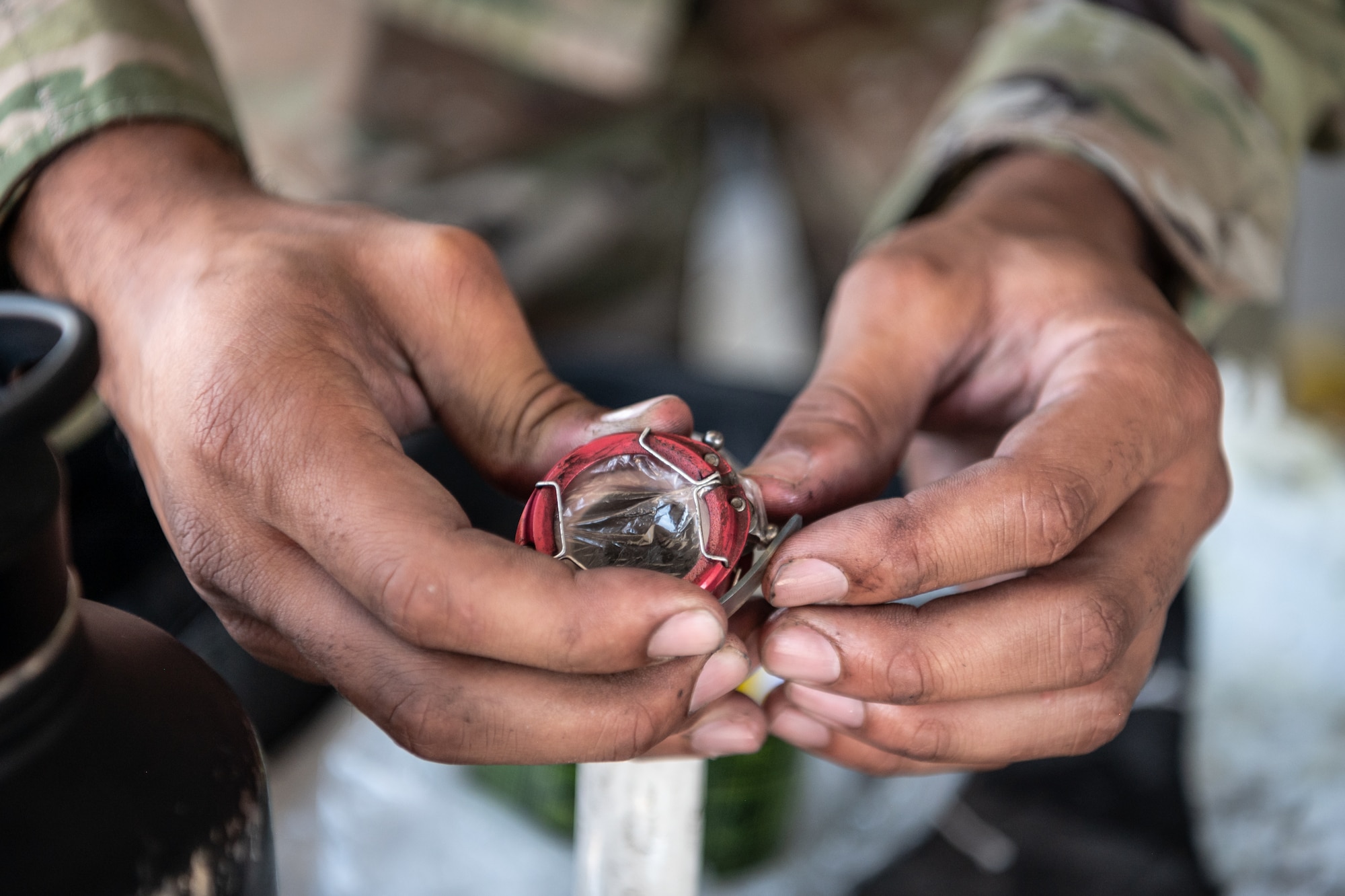 A Reserve Citizen Airman from the 944th Maintenance Group carefully examines a component of an F-35 at Luke Air Force Base, Ariz., Sept. 8, 2024. The maintainers' expertise ensures that every jet is safe and mission-ready. (U.S. Air Force photo by Tech. Sgt. Tyler J. Bolken)
