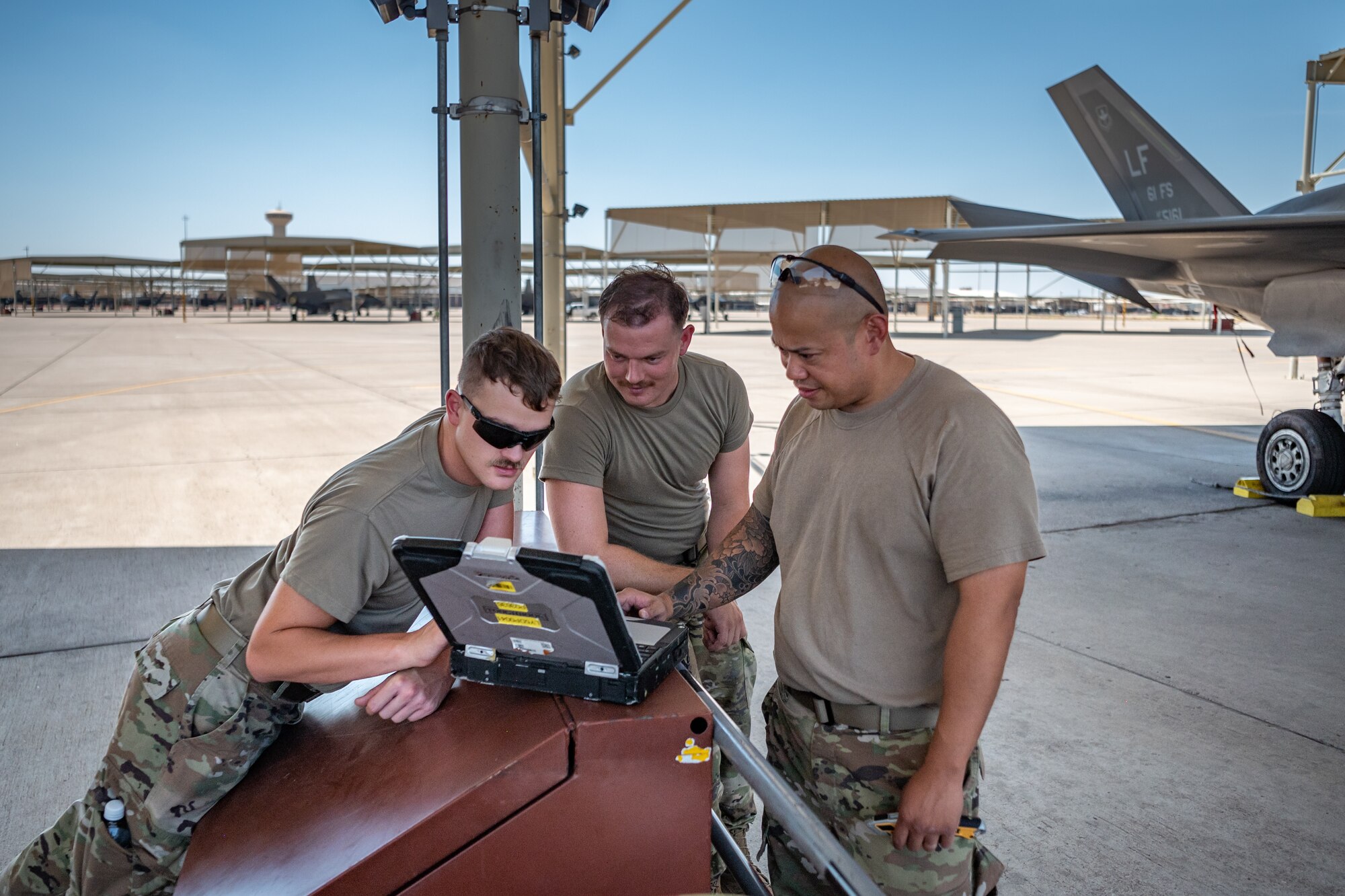 Reserve Citizen Airmen from the 944th Maintenance Group collaborate while conducting F-35 maintenance at Luke Air Force Base, Ariz., Sept. 8, 2024. Their teamwork ensures mission readiness for the fighter jets. (U.S. Air Force photo by Tech. Sgt. Tyler J. Bolken)