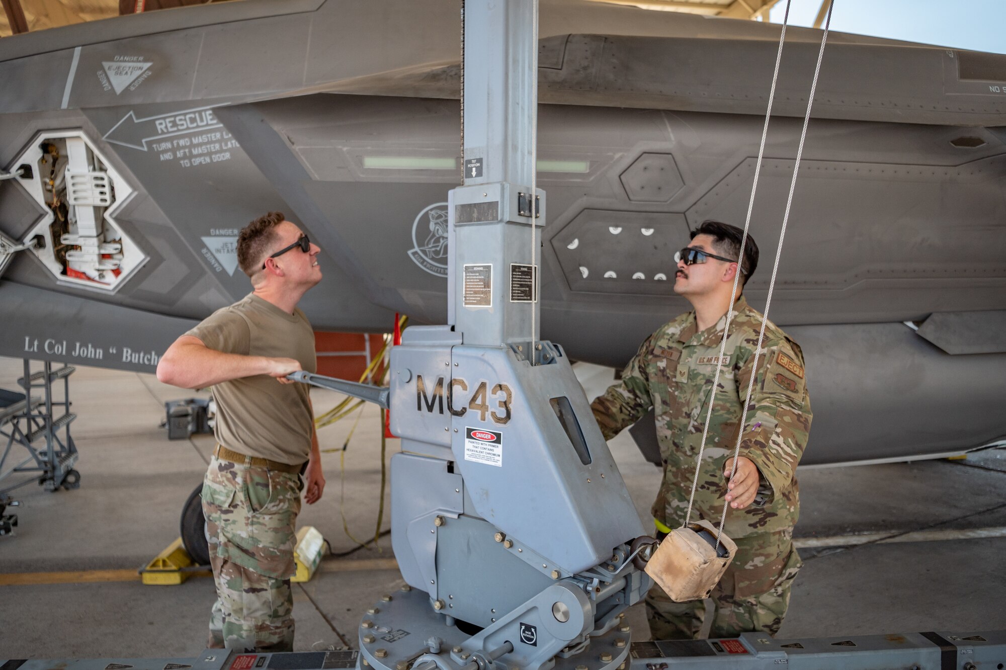 Two Reserve Citizen Airmen of the 944th Maintenance Group use a hoist while conducting maintenance on an F-35 at Luke Air Force Base, Ariz., Sept. 8, 2024. Their expertise ensures the readiness of the Air Force’s most advanced aircraft. (U.S. Air Force photo by Tech. Sgt. Tyler J. Bolken)
