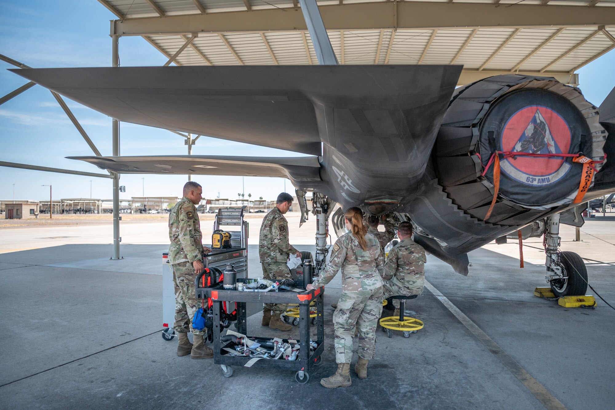 Reserve Citizen Airmen from the 944th Maintenance Group work on the engine of an F-35 under the hot Arizona sun at Luke Air Force Base, Sept. 8, 2024. The maintainers collaborate with active-duty personnel to ensure safe and ready jets for the mission. (U.S. Air Force photo by Tech. Sgt. Tyler J. Bolken)