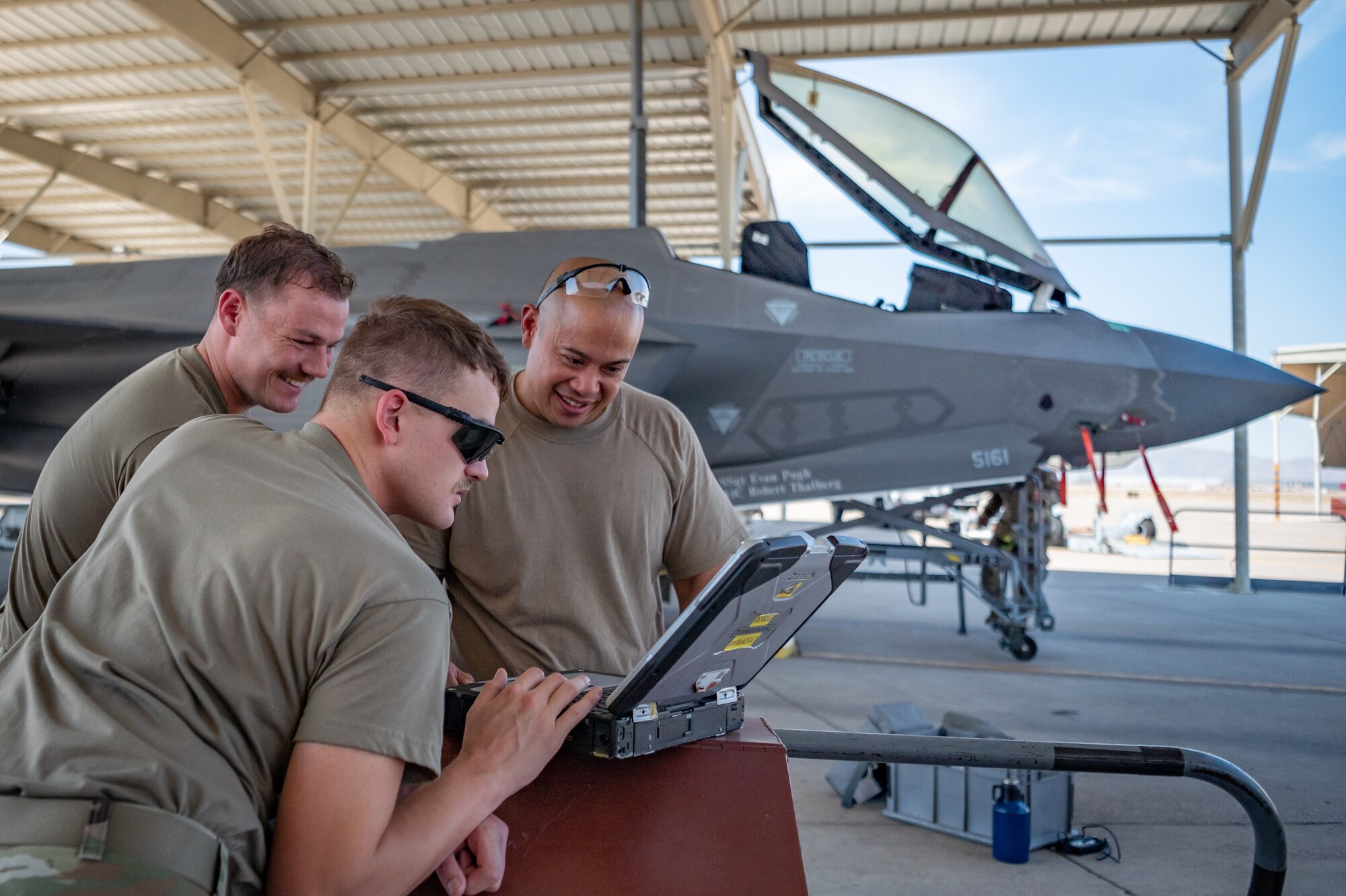 Reserve Citizen Airmen from the 944th Maintenance Group review technical data while performing maintenance on an F-35 fighter jet at Luke Air Force Base, Ariz., Sept. 8, 2024. Their detailed work ensures the safety and readiness of the aircraft. (U.S. Air Force photo by Tech. Sgt. Tyler J. Bolken)