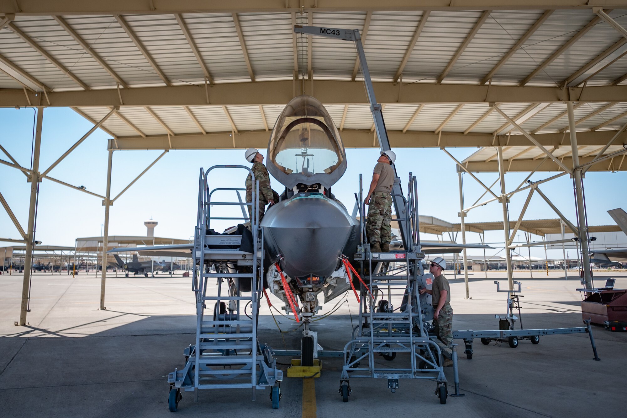Reserve Citizen Airmen from the 944th Maintenance Group use a hoist system to remove an ejection seat from an F-35 fighter jet at Luke Air Force Base, Ariz., Sept. 8, 2024. Their coordination is crucial to maintain the aircraft's functionality. (U.S. Air Force photo by Tech. Sgt. Tyler J. Bolken)