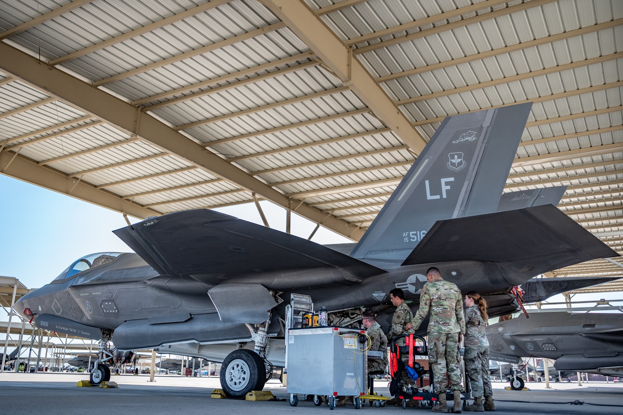 Reserve Citizen Airmen from the 944th Maintenance Group conduct detailed inspections and repairs on an F-35 fighter jet at Luke Air Force Base, Ariz., Sept. 8, 2024. Their teamwork ensures mission success and operational readiness in the intense desert heat. (U.S. Air Force photo by Tech. Sgt. Tyler J. Bolken)