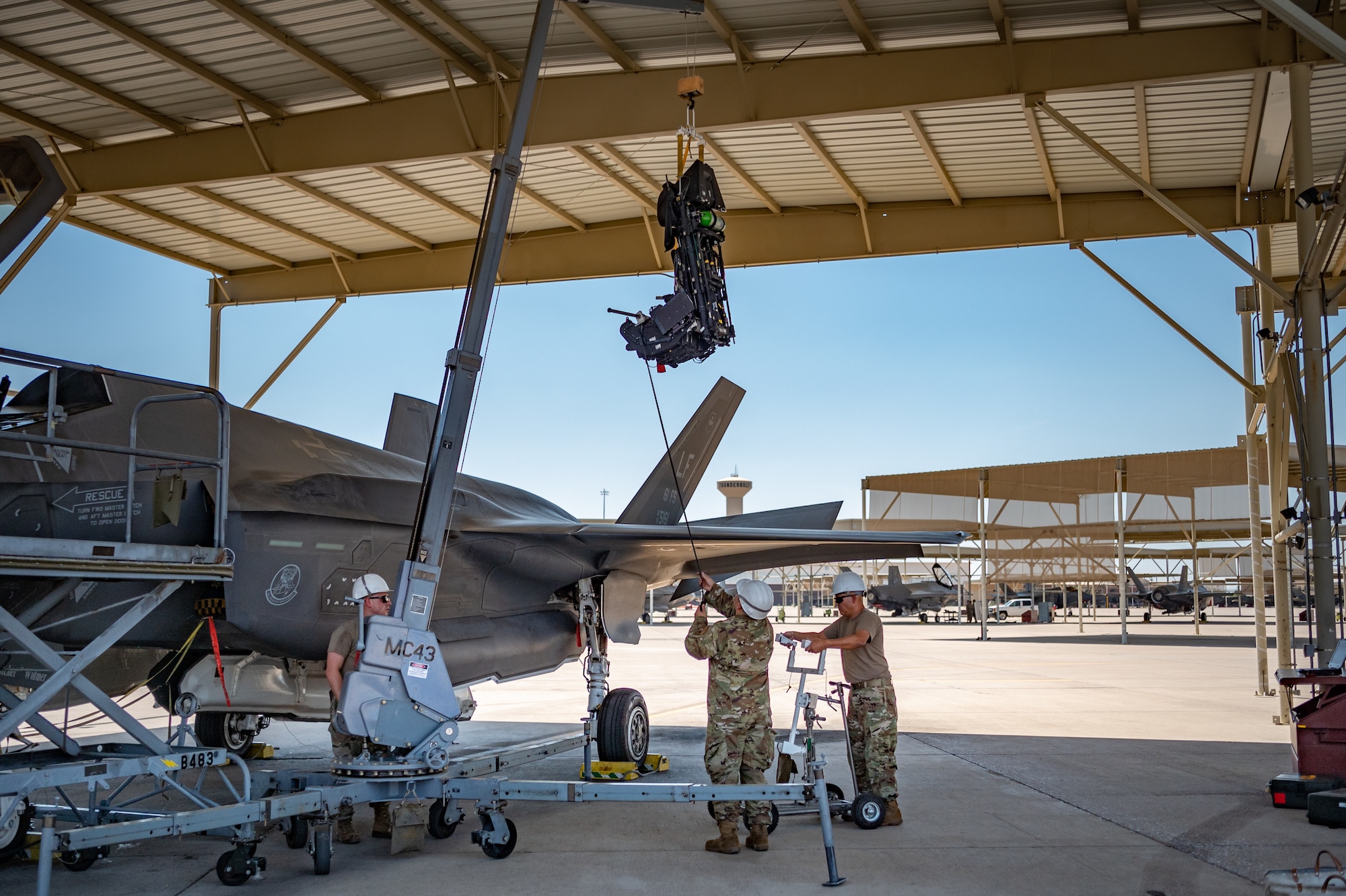 A team of Reserve Citizen Airmen from the 944th Maintenance Group works together to remove an ejection seat on an F-35 fighter jet at Luke Air Force Base, Ariz., Sept. 8, 2024. The maintainers' dedication ensures that the jets are ready for the Air Force's mission. (U.S. Air Force photo by Tech. Sgt. Tyler J. Bolken)